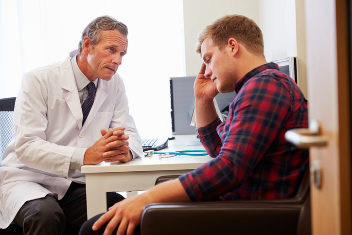 Doctor Treating Male Patient Suffering With Depression